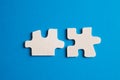 White details of puzzle on blue background Royalty Free Stock Photo