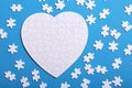 White details of a puzzle on a blue background. A puzzle is a pu Royalty Free Stock Photo