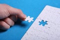 White details of a puzzle on a blue background. A puzzle is a pu Royalty Free Stock Photo