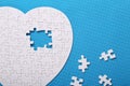 White details of a puzzle on a blue background. A puzzle is a pu Royalty Free Stock Photo