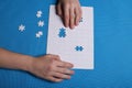 White details of a puzzle on a blue background. A puzzle is a pu Royalty Free Stock Photo