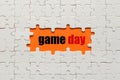 White details of puzzle on orange background and word Game Day