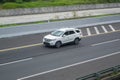 white DFSK Glory 560 or Dongfeng Fengguang S560 driving fast on trans jawa highway toll road