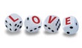 White dice with black eyes numbers spelling LOVE in red letters Royalty Free Stock Photo