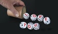 White dice with black eyes numbers spelling LOVE YOU  in red letters rolling out from a raffle cup Royalty Free Stock Photo