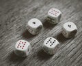 White dice on dark background. Gambling devices. Copy space for text. All number five. Royalty Free Stock Photo