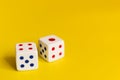 White dice on yellow background