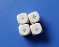 white dices with playing cards symbols on ble background Royalty Free Stock Photo