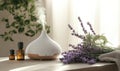 A white diffuser with lavender flowers on a table Royalty Free Stock Photo