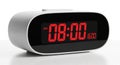 White Digital Alarm Clock Displaying 08:00 AM in Red LED on White Surface digital clock Royalty Free Stock Photo