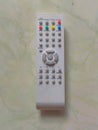 White digital television remote used to control television broadcasts Royalty Free Stock Photo