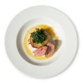 White diner plate with lamb loin spinach and potato rosti Royalty Free Stock Photo