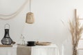 White dining room interior with beige decorations