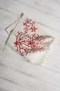 White Dinner Napkin with Red Coral and Starfish Print Royalty Free Stock Photo