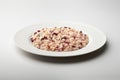 White dinner plate with Treviso red radicchio risotto Royalty Free Stock Photo