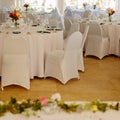 White dinner set up for a wedding. Tables and chairs. Square image. Royalty Free Stock Photo