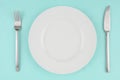 White dishes on aqua tablecloth