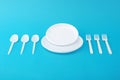 White disposable dishes, fork and spoon Royalty Free Stock Photo