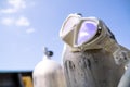 A white diving mask hanging on the oxygen tank for scuba diving Royalty Free Stock Photo