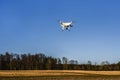 NEIDLINGEN, GERMANY - FEBRUARY 24, 2019: Front view of DJI Phantom 4 PRO quadcopter drone flying on blue sky Royalty Free Stock Photo