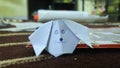 White dog origami drwan with face