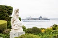 White Dolphin Statue with Cruise Ship Royalty Free Stock Photo