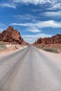 White Domes Road cutting through rock formations of red Aztec sandstone in the Valley of Fire State Park, Nevada Royalty Free Stock Photo