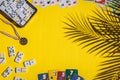 White dominoes, playing cards, uno, ligretto and winner medal on yellow background. Board game. Royalty Free Stock Photo
