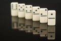 White dominoes showing leader or winner Royalty Free Stock Photo