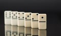 White dominoes showing leader or winner Royalty Free Stock Photo