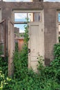 The white door of an abandoned wrecked house Royalty Free Stock Photo