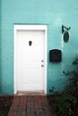 White Door and Blue Brick Wall Royalty Free Stock Photo
