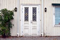 White door decorated with ornaments Royalty Free Stock Photo