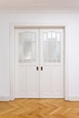 White door double sliding parquet Royalty Free Stock Photo