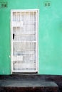 White door, Turquoise Wall, Black Steps