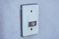 Doorbell Button with Music Note Icon on White Wall Royalty Free Stock Photo
