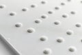 White dots, texture abstract background. Some braille text close up Royalty Free Stock Photo