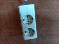 White Double Electric Wall Socket on Wood Surface Royalty Free Stock Photo