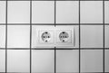 White double electrical outlet mounted on white wall Royalty Free Stock Photo