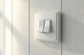 White double light switch on textured wall with soft shadow light. Simple home appliance for interior power control and Royalty Free Stock Photo