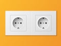 White double power socket on orange wall