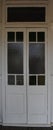 White double wooden doors with inset windows