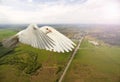 White dove flying over the city and the road with sunny hotspot Royalty Free Stock Photo