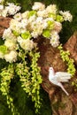 White Dove on Paper Tree with White Flowers, Orchid and Leaves for Decoration Royalty Free Stock Photo