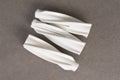 white dowel for foam concrete on a gray background Royalty Free Stock Photo