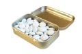 White dragees in elegant metal packaging. Shiny gold candy tin isolate on white background