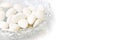 White dragees in a plate for baptism or wedding on panoramic background Royalty Free Stock Photo