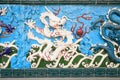 White dragon on blue background, ceramics. Nine Dragon Wall at Garden of Friendship, St. Petersburg, Russia. This is copy of the Royalty Free Stock Photo