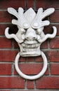 A White Dragon Face Door Knocker