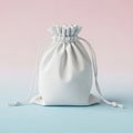 A white drawstring bag on a pink and blue background Royalty Free Stock Photo